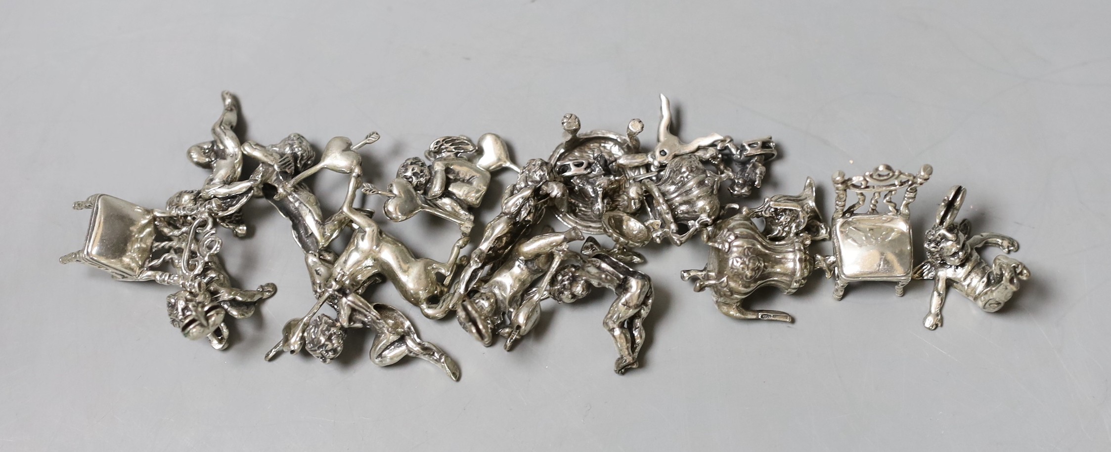 A small group of modern miniature white metal dolls house toys including 800 standard.